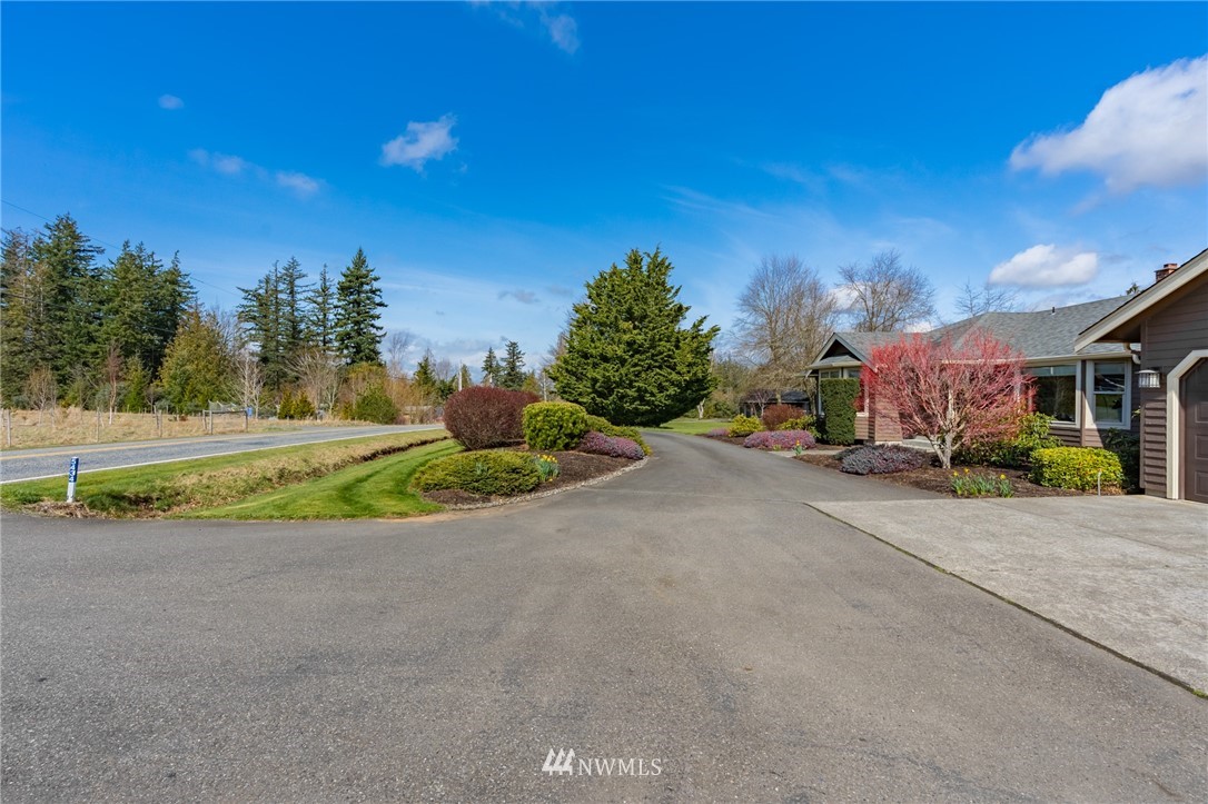 5434 Noon Road Bellingham, WA 98226 - Photo 3 of 40 a view of a road with a house