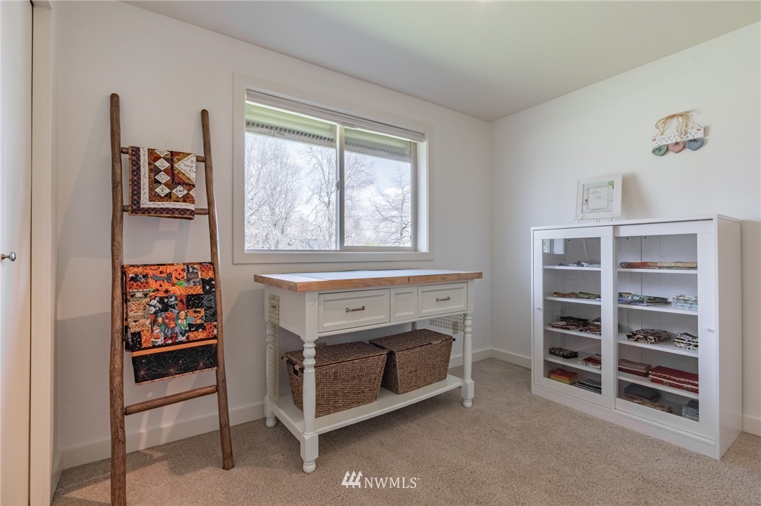 5434 Noon Road Bellingham, WA 98226 - Photo 22 of 40 a living room with furniture and a fireplace