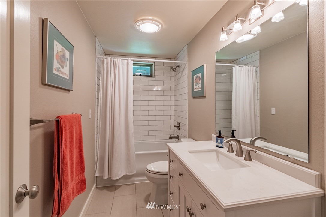 5434 Noon Road Bellingham, WA 98226 - Photo 24 of 40 a bathroom with a sink vanity mirror and toilet