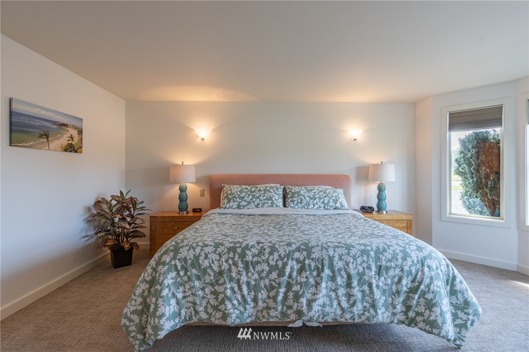 5434 Noon Road Bellingham, WA 98226 - Photo 26 of 40 a bedroom with a bed and mirror