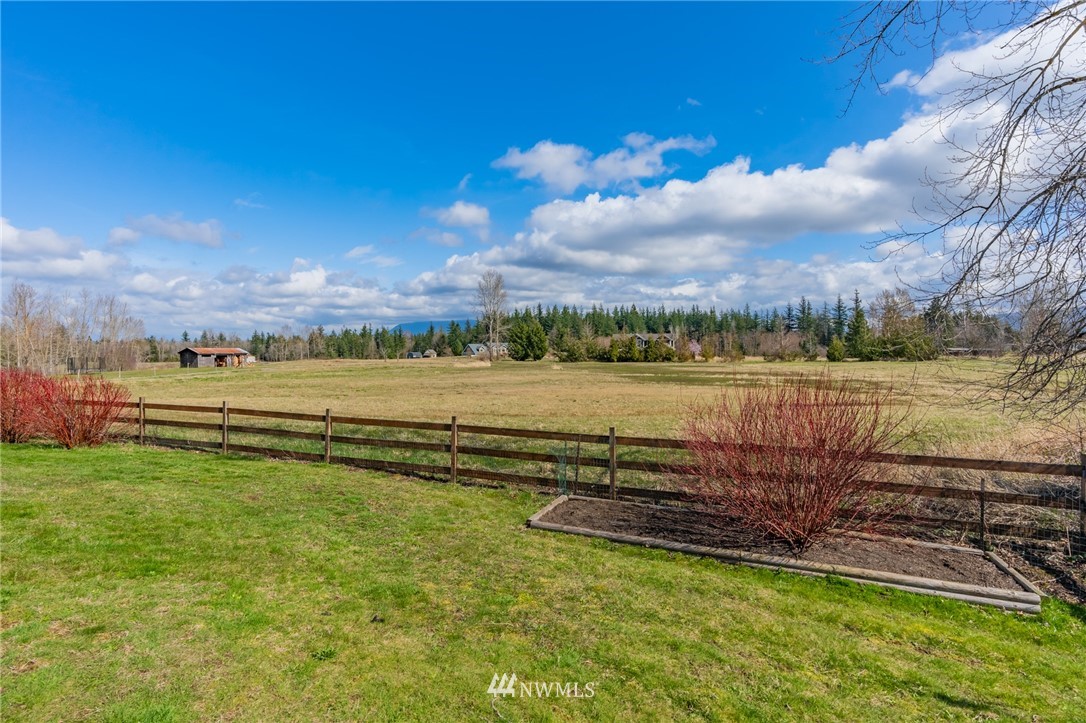 5434 Noon Road Bellingham, WA 98226 - Photo 4 of 40 a view of a lake with houses in the back
