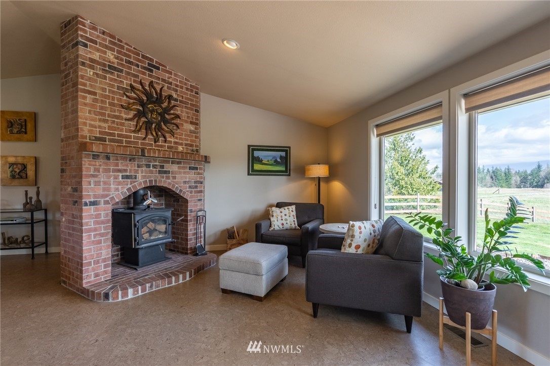 5434 Noon Road Bellingham, WA 98226 - Photo 31 of 40 a living room with furniture and a fireplace