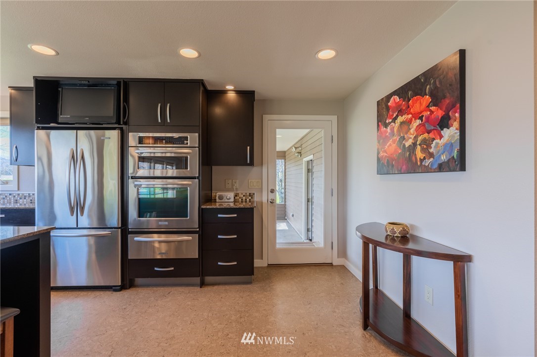 5434 Noon Road Bellingham, WA 98226 - Photo 36 of 40 a kitchen with stainless steel appliances a refrigerator and a stove top oven