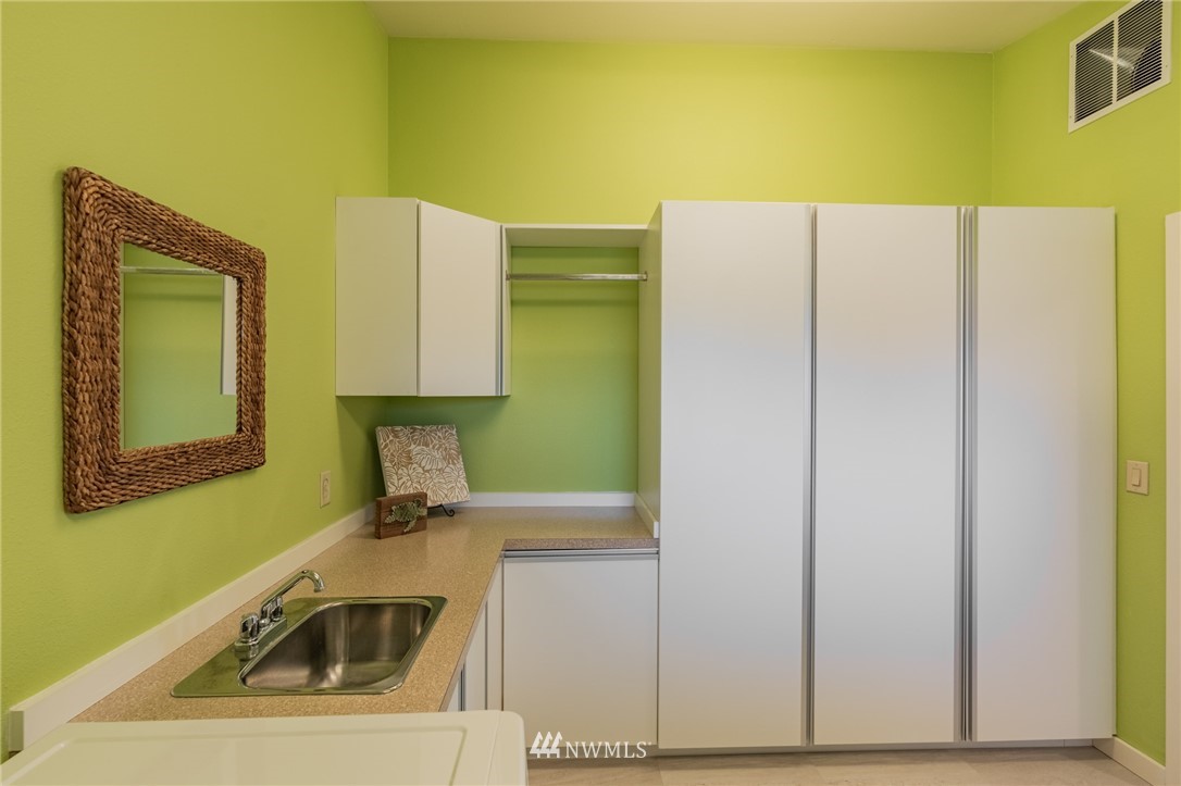 5434 Noon Road Bellingham, WA 98226 - Photo 39 of 40 a kitchen with a sink and a refrigerator