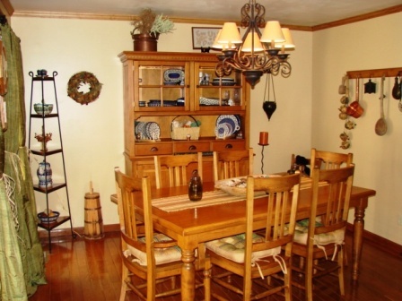 131 London Ridge Road Boones Mill, VA 24065 - Photo 13 of 37 a view of a dining room with furniture and chandelier