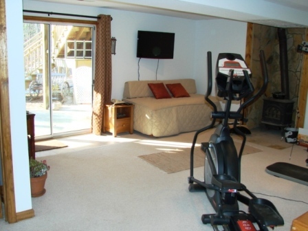 131 London Ridge Road Boones Mill, VA 24065 - Photo 24 of 37 a room with gym equipment and a flat screen tv