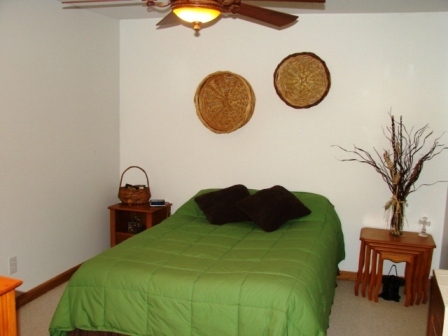 131 London Ridge Road Boones Mill, VA 24065 - Photo 28 of 37 a bedroom with a bed and a chair