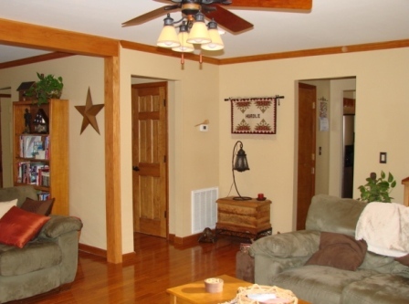131 London Ridge Road Boones Mill, VA 24065 - Photo 6 of 37 a living room with furniture and a chandelier