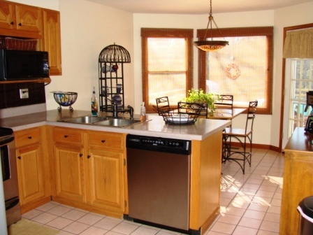 131 London Ridge Road Boones Mill, VA 24065 - Photo 8 of 37 a kitchen with sink a large window and chairs