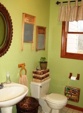 131 London Ridge Road Boones Mill, VA 24065 - Photo 9 of 37 a bathroom with a toilet a sink and a mirror