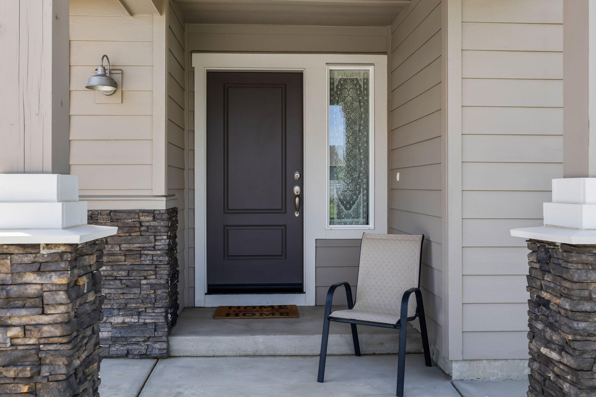 1132 Northwest Golf Course Drive Madras, OR 97741 - Photo 4 of 36 a view of a door and chair in front of door