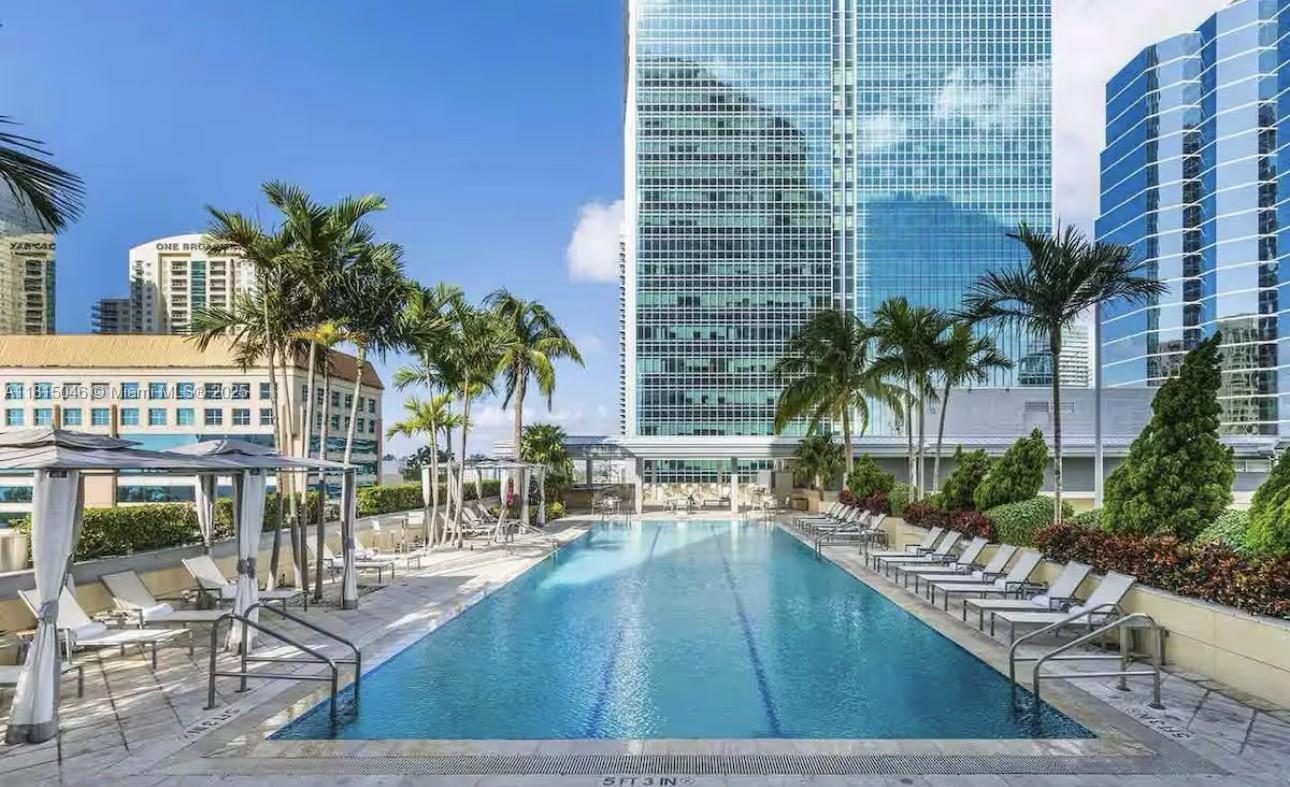 1395 Brickell Avenue, Unit 2814 Miami, FL 33131 - Photo 15 of 17 a view of a swimming pool with outdoor seating