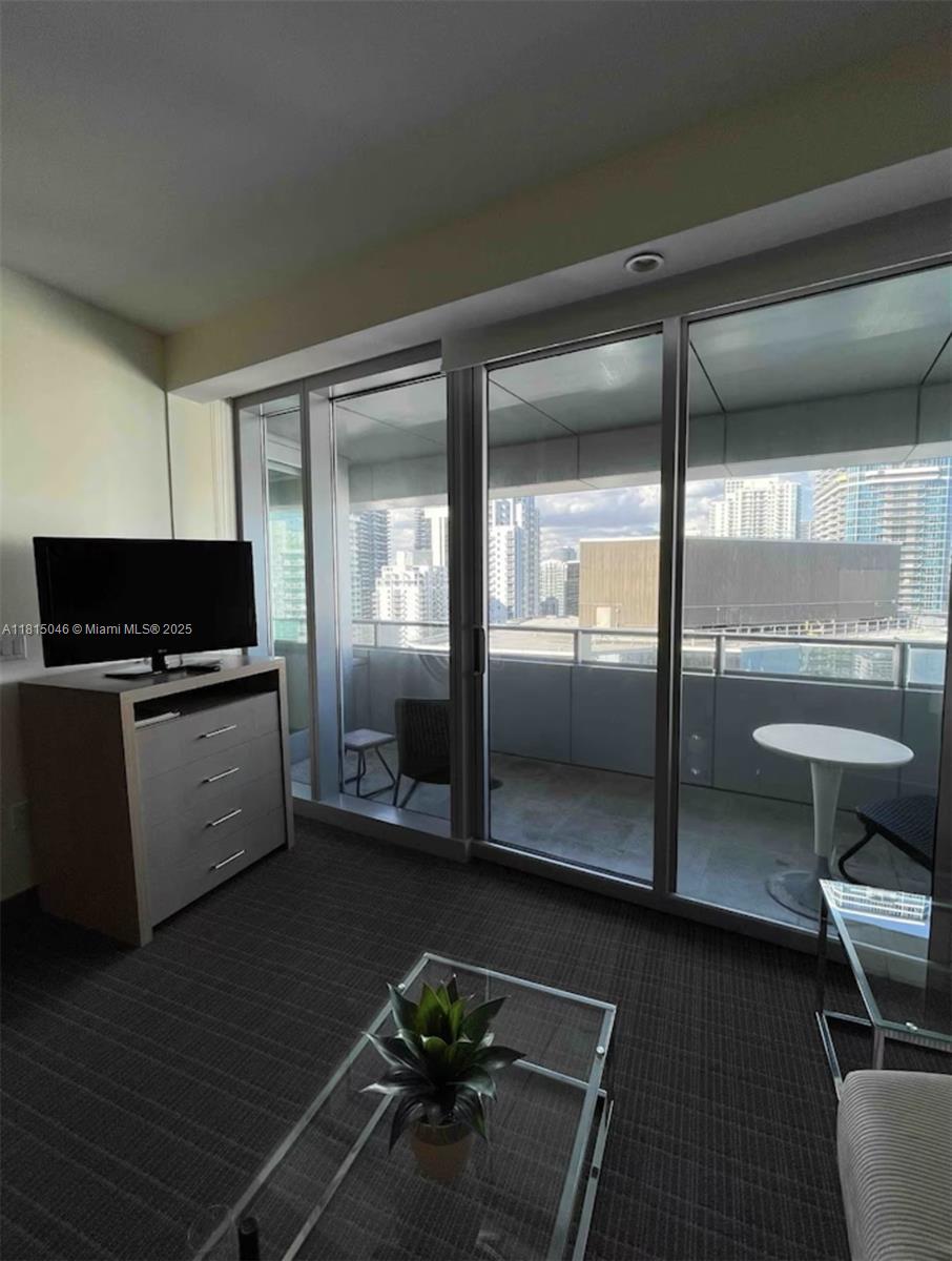 1395 Brickell Avenue, Unit 2814 Miami, FL 33131 - Photo 3 of 17 a kitchen with a refrigerator and potted plant