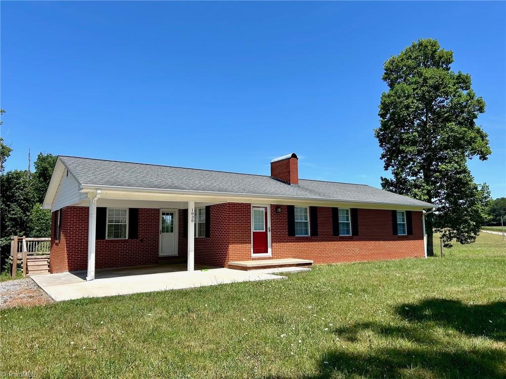 1838 Dobbins Mill Road Elkin, NC 28621 - Photo 2 of 13 covered area for porch or cara storage plus a pad