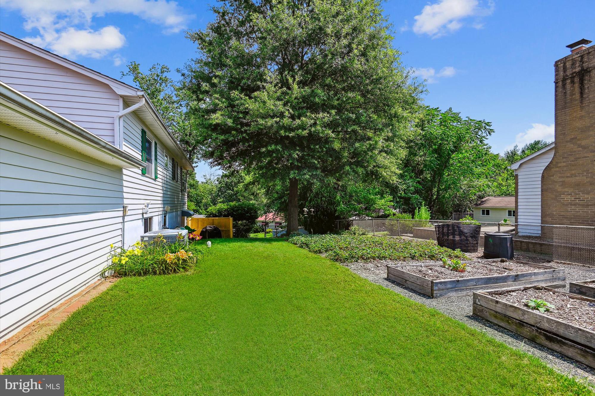 477 Rita Drive Odenton, MD 21113 - Photo 6 of 55 Well-Tended Yard with Raised Garden Beds