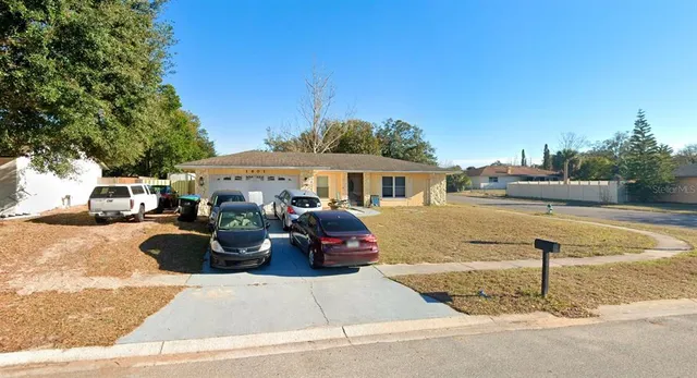 a front view of a house with parking area
