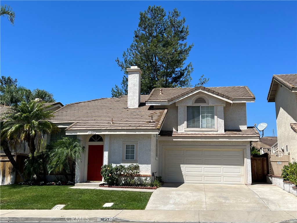 11647 Chadwick Road Corona, CA 92878 - Photo 1 of 1 a front view of a house with garden