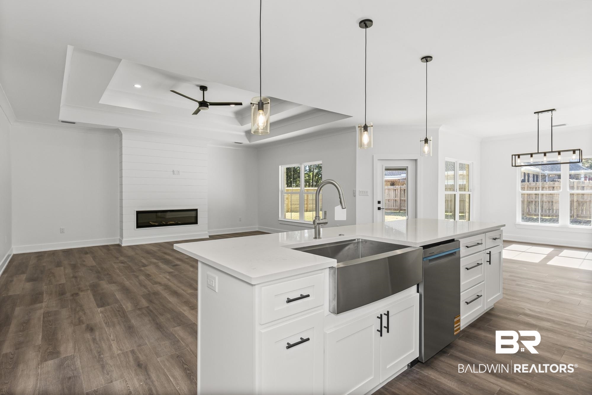 10180 Pineview Drive Foley, AL 36535 - Photo 46 of 47 Kitchen with decorative light fixtures, white cabinets, open floor plan, a ceiling fan, and crown molding