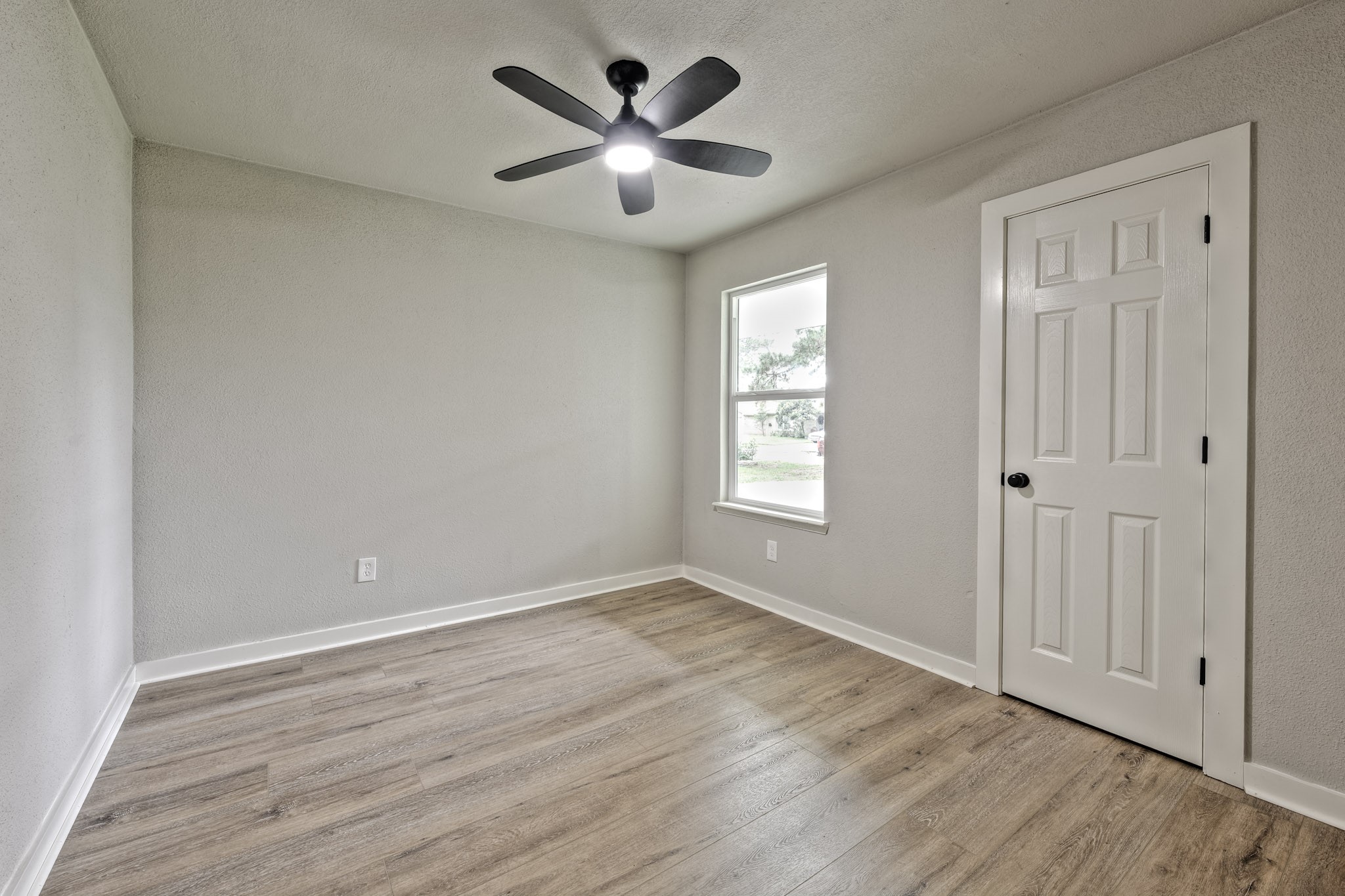 4926 Adonis Drive Spring, TX 77373 - Photo 11 of 16 wooden floor in an empty room with a window