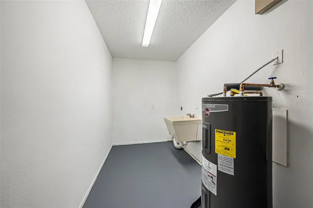 a view of storage and utility room with washer and dryer