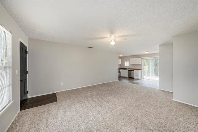 a view of a livingroom with a kitchen