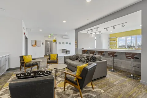 a living room with furniture and a large window