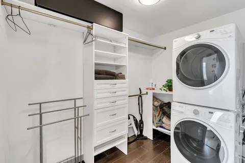 a view of walk in closet with empty racks