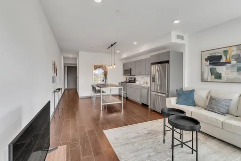 a living room with furniture and a table