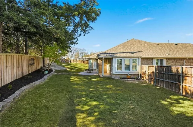 a view of a house with a yard porch and sitting area