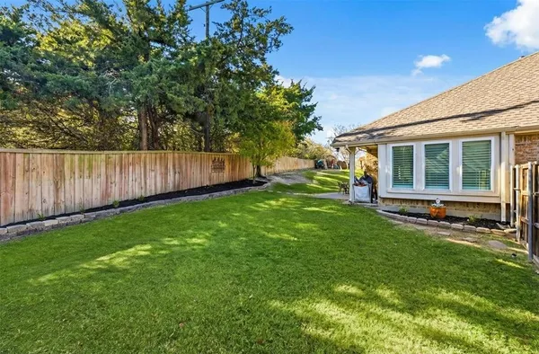 a view of a backyard with a sitting area