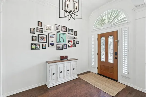 a view of an entryway with wooden floor