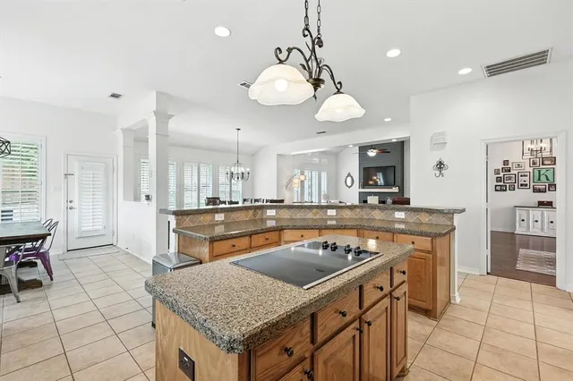 a kitchen with stainless steel appliances granite countertop a stove and a sink