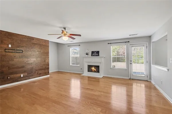 a view of a livingroom with a flat screen tv and fireplace