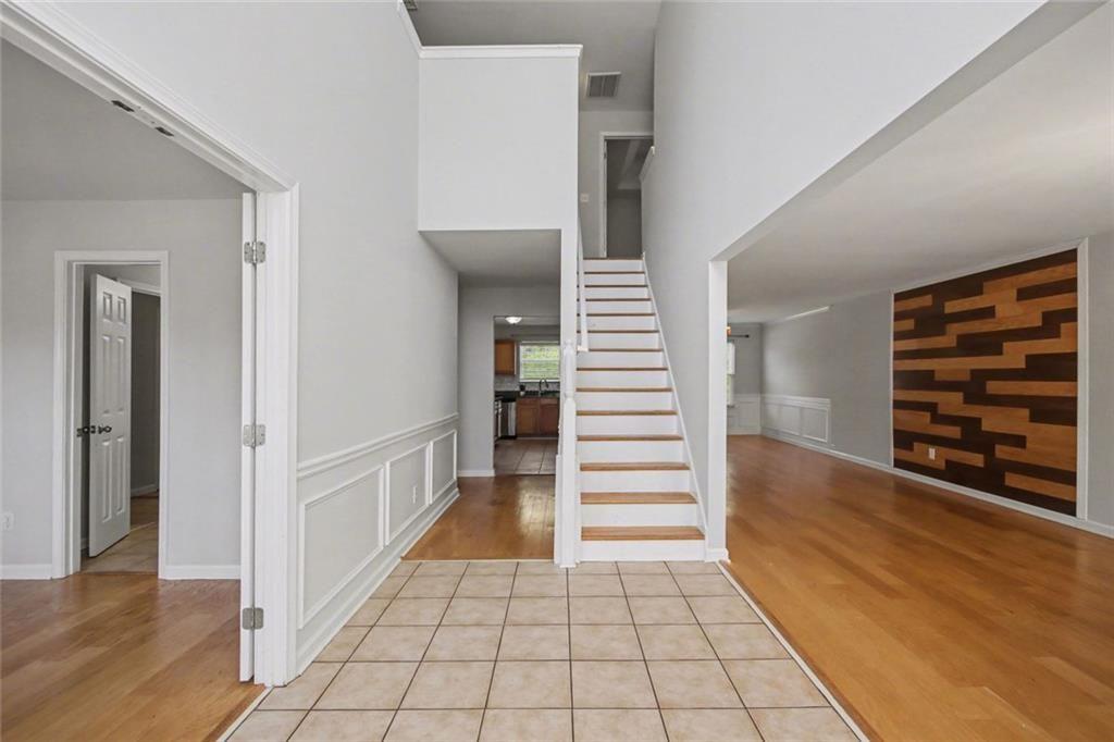 4350 Defoors Farm Trail Powder Springs, GA 30127 - Photo 2 of 35 a view of an entryway wooden floor and a living room