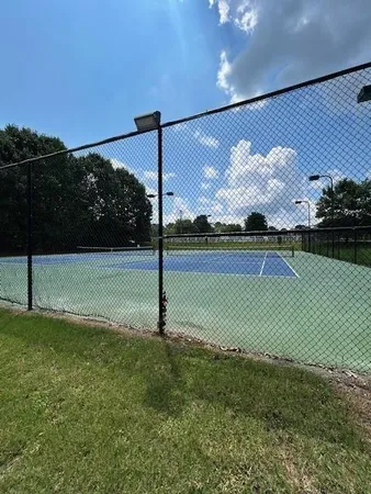 a view of a swimming pool with lounge chair