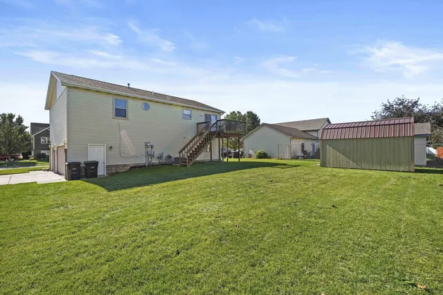 a view of a backyard of the house