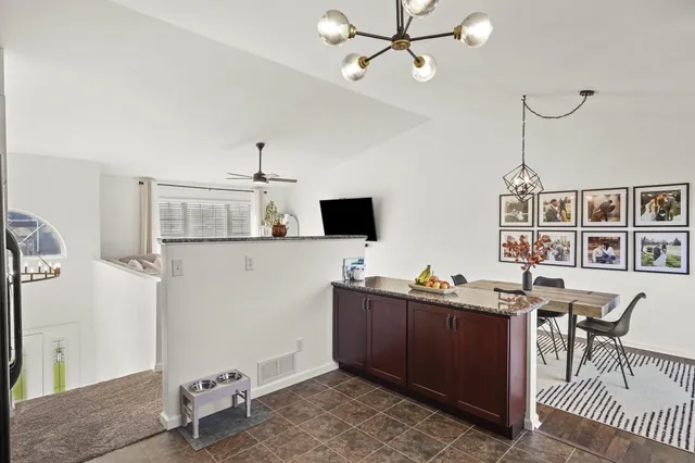 a view of a workspace with furniture