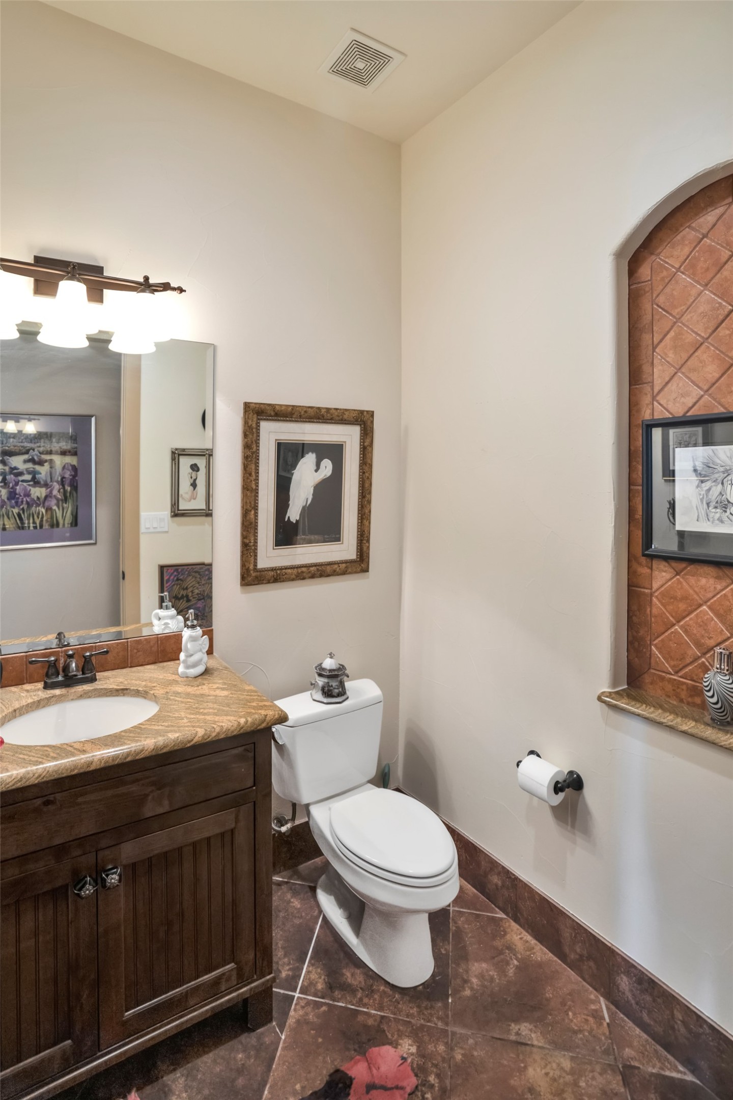 601 Strada Luca Florence, TX 76527 - Photo 18 of 40 a bathroom with a toilet a sink and mirror