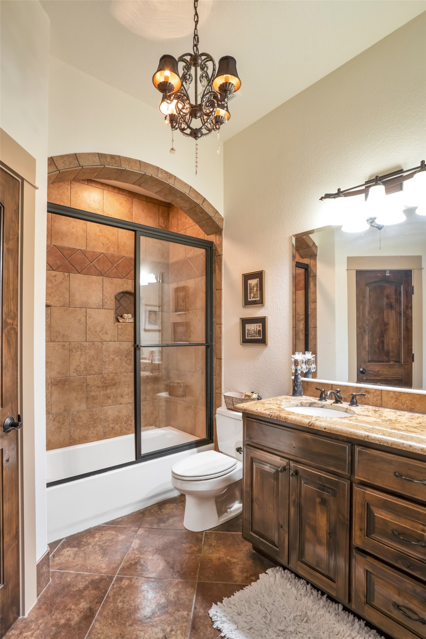 601 Strada Luca Florence, TX 76527 - Photo 24 of 40 a spacious bathroom with a granite countertop sink a toilet a mirror and a shower