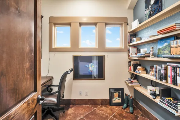 a view of a chairs and table on the wooden floor