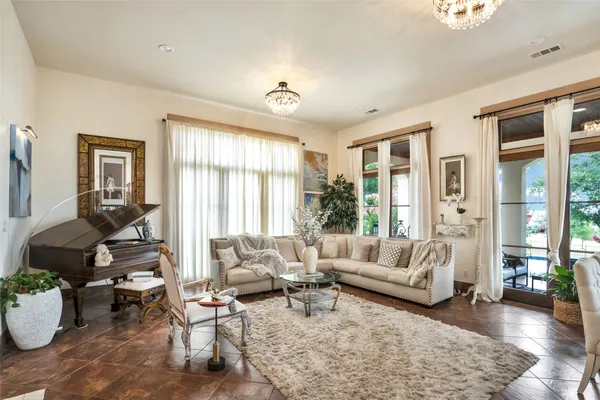 a living room with furniture and a large window