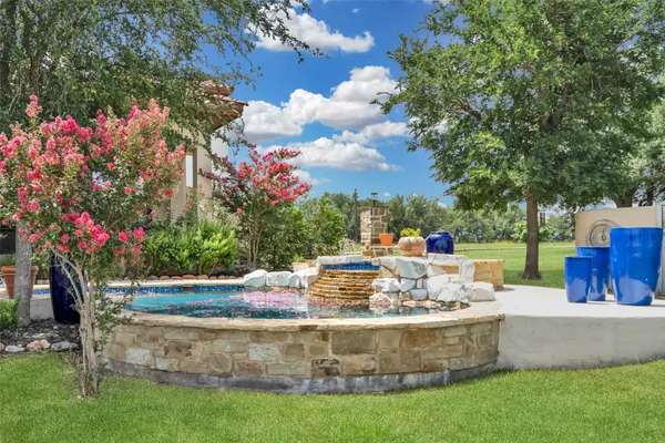 a view of a patio with swimming pool