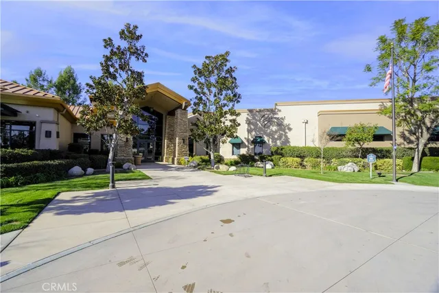 a view of a patio with table and chairs potted plants