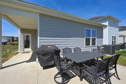 a view of a patio with couple of chairs