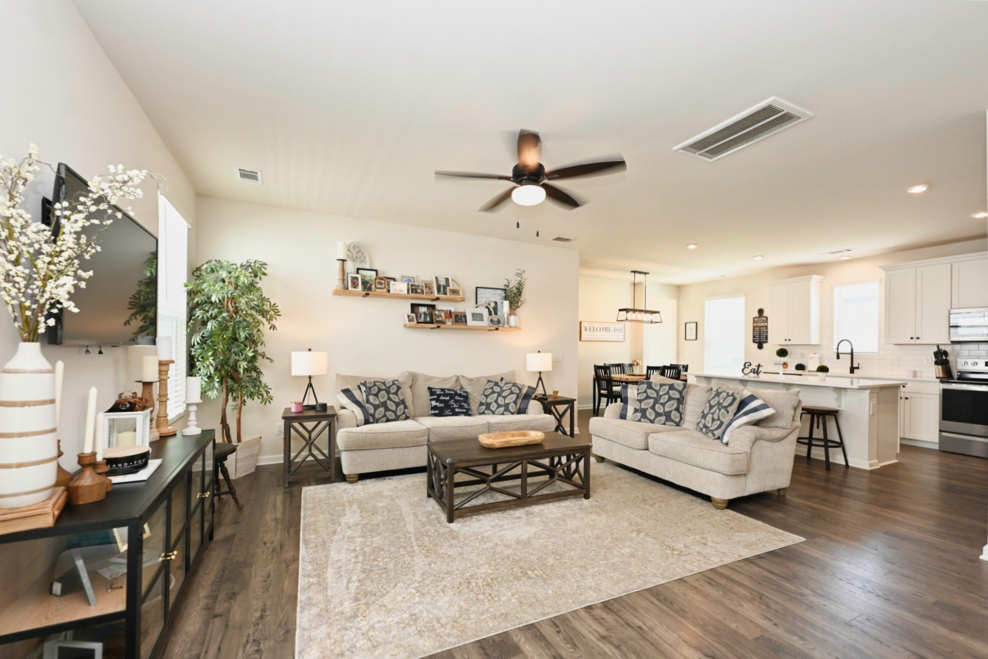 522 Red Barn Way Mount Juliet, TN 37122 - Photo 3 of 25 a living room with furniture kitchen view and a chandelier
