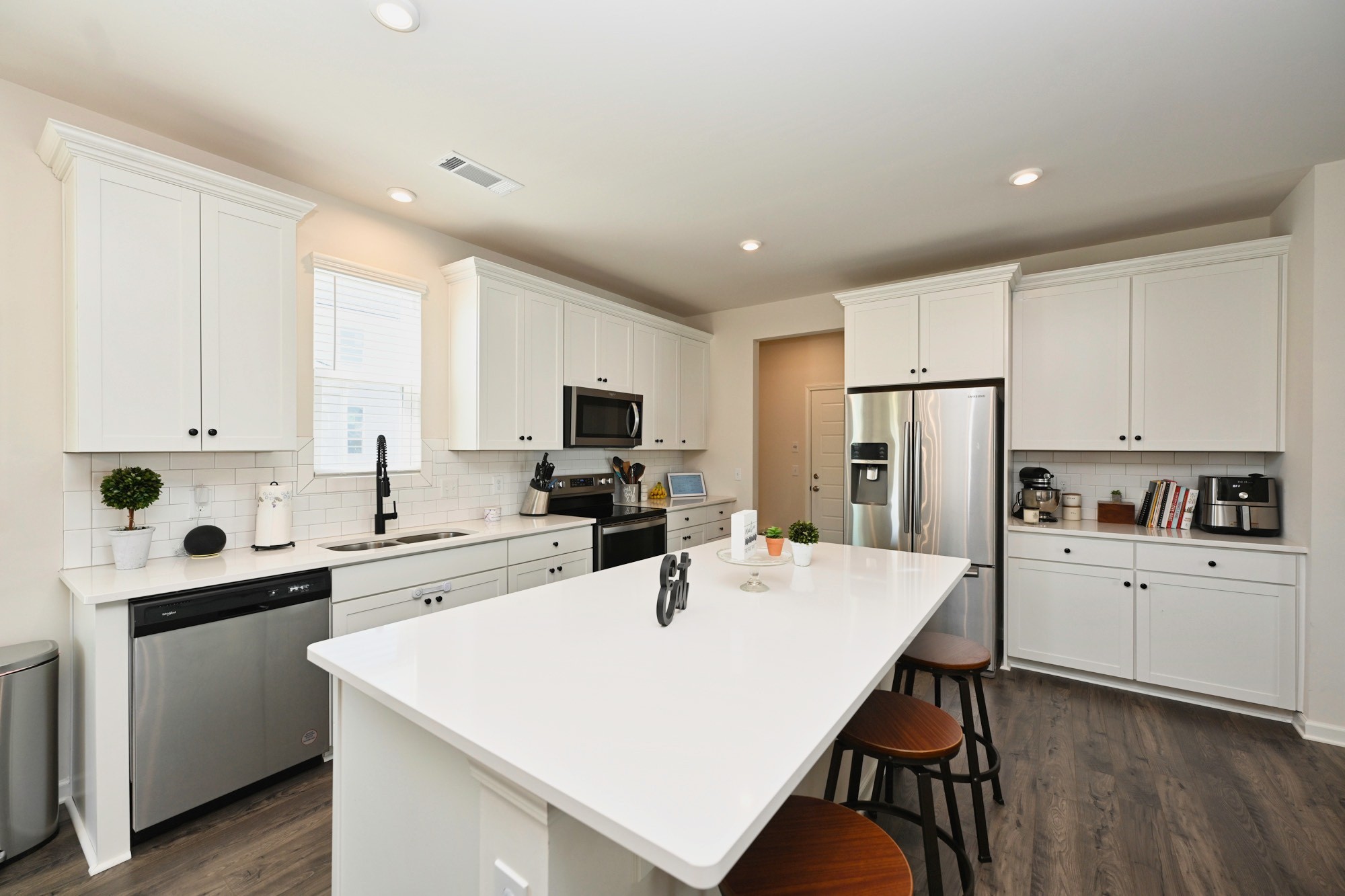 522 Red Barn Way Mount Juliet, TN 37122 - Photo 7 of 25 a kitchen with white cabinets and white appliances