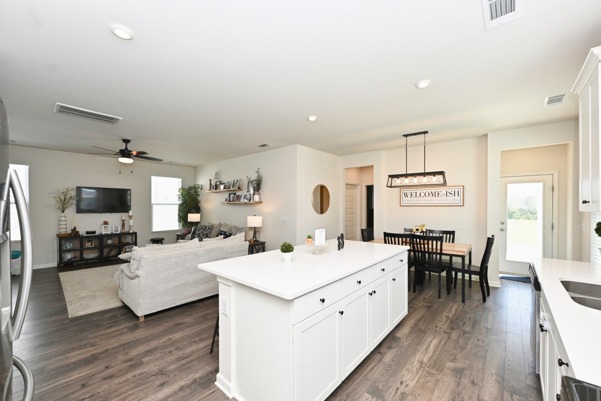 522 Red Barn Way Mount Juliet, TN 37122 - Photo 8 of 25 a large room with stainless steel appliances kitchen island granite countertop a sink and wooden floor