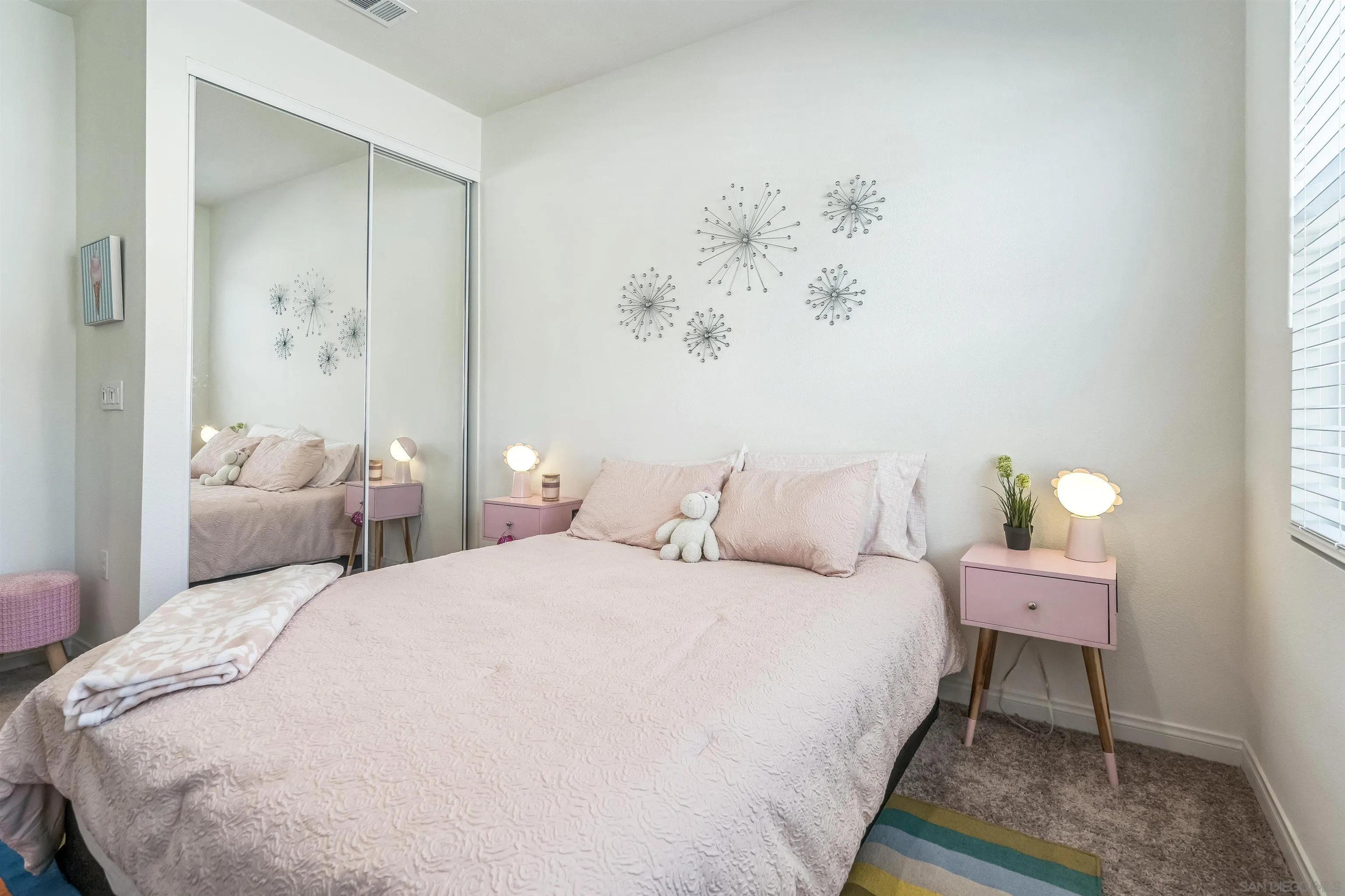 2018 Barite Street Spring Valley, CA 91977 - Photo 39 of 47 a bedroom with a bed and a painting on the wall