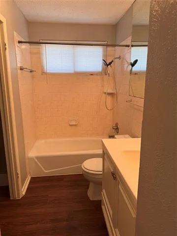a bathroom with a shower and a toilet
