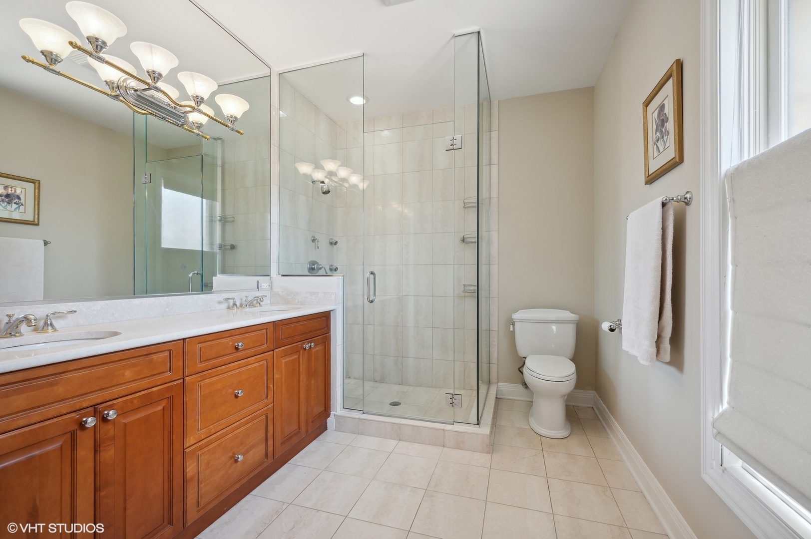 948 Green Bay Road Glencoe, IL 60022 - Photo 10 of 21 a spacious bathroom with a granite countertop sink a toilet and a shower